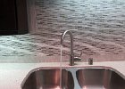 Kitchen sink with marble tile back spash.jpg
